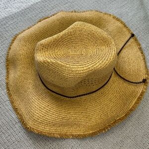Straw cowboy hat with brown chord
